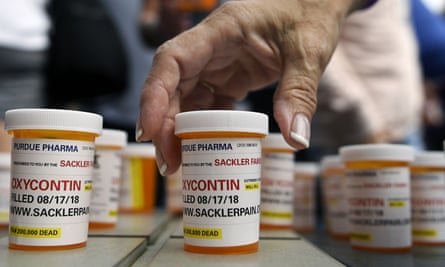 Family and friends who have lost loved ones to OxyContin and opioid overdoses leave pill bottles in protest outside the headquarters of Purdue Pharma, which is owned by the Sackler family, in Stamford, Connecticut.