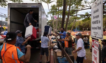 Volunteers unload ice and cooler donations at a distribution center at Honokawai Beach Park in Napili-Honokowai in Hawaii.
