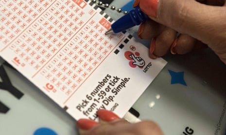 A member of the public buys a National Lottery ticket