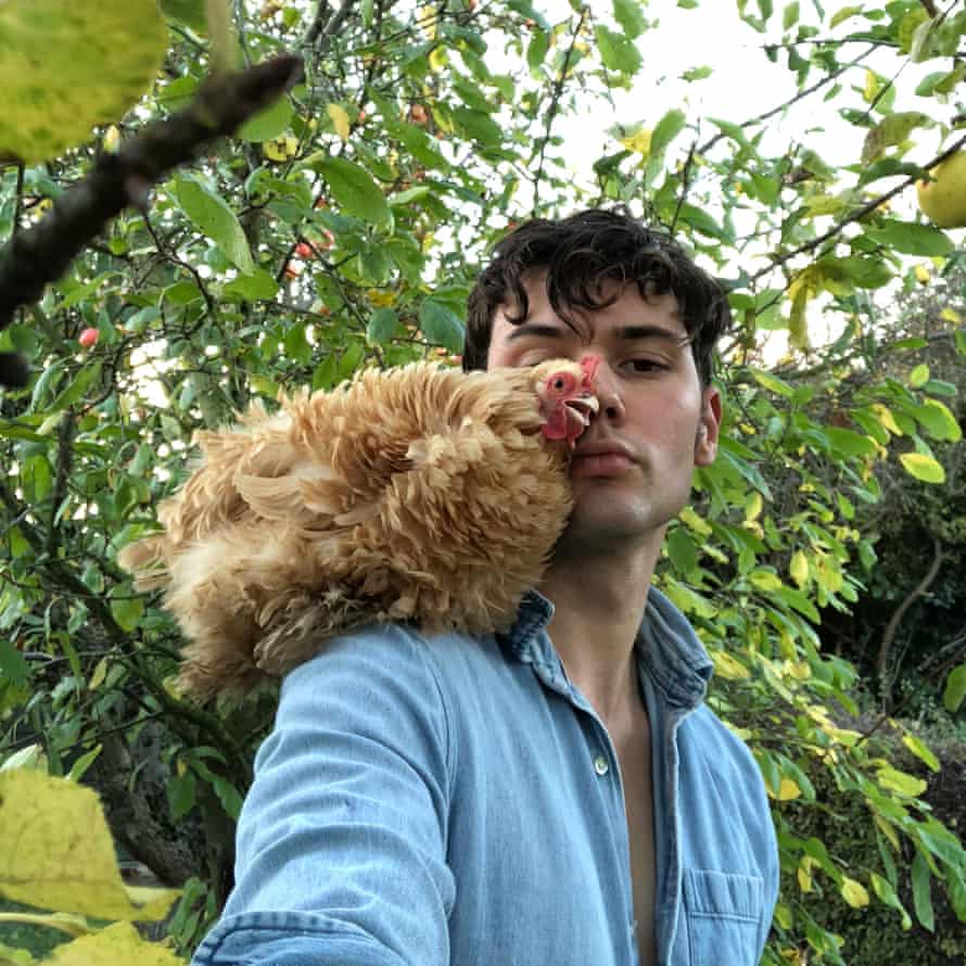 photo of man and chicken