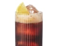 Circle 13's Cherry Kalimotxo is A tall ridged glass filled with dark liquid, ice, and a lemon wedge garnish on top.