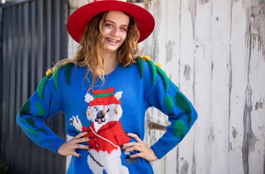 Mary is wearing a vintage acacia and wombat sweater from Retro Color Pop, which appeared on the Australian sitcom Kath and Kim.  Retro Colourpop owner Bec Grant sources vintage sweaters from across Australia to sell online.