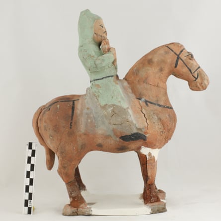 A terracotta cavalryman statuette.