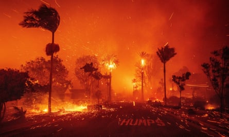 A street surrounded by fire, with a smoke-filled sky