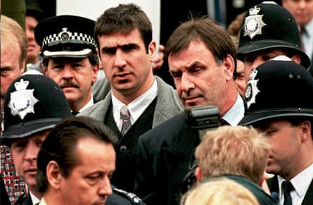 Eric Cantona leaves court after successfully appealing against a jail sentence for assaulting a Crystal Palace fan.