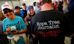 A Donald Trump supporter at a rally in Minneapolis, Minnesota, makes his feelings about journalists known.