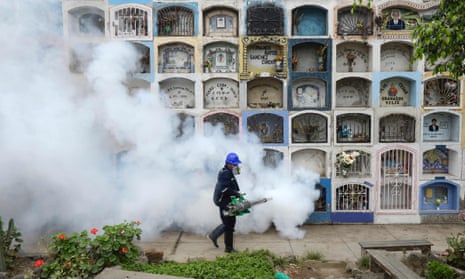 A fumigator at work in a graveyard in Lima as part of Peru’s efforts to contain the Zika virus.