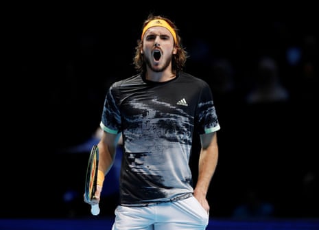 Tsitsipas celebrates holding his service to square the game.