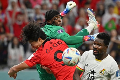 Ghana's goalkeeper Lawrence Ati Zigi (centre), South Korea's Jo Gue-sung go up for the ball as Ghana's Daniel Amartey looks on in a goal-mouth scramble.