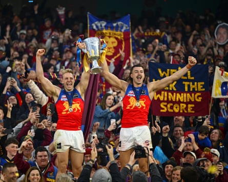 Oscar Allen and Sam Draper of the Brisbane Lions celebrate winning the AFL Grand Final.