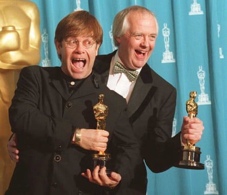 Feel the love … with Elton John at the Oscars in 1995.