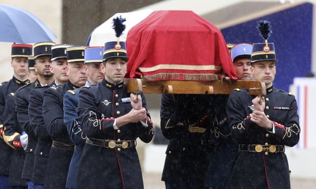 Arnaud Beltrame’s coffin is carried during the ceremony at the Hotel des Invalides in Paris.