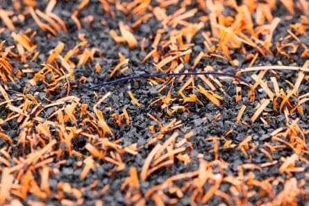 Close up on artificial turf formed from soft plastic blades of ‘grass’ and rubber