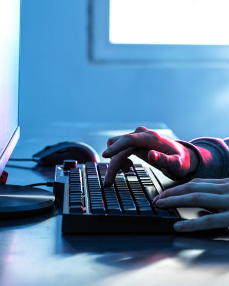 A person using a computer at their desk