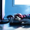 A person using a computer at their desk