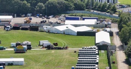 Aerial view of some of the security fencing, tents and portable toilets