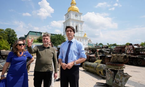 Trudeau, centre, and Ukraine’s deputy prime minister and minister of finance, Chrystia Freeland, left, are shown burned-out Russian tanks by Ukraine deputy defence minister, Oleksandr Polishchuk, in Kyiv.