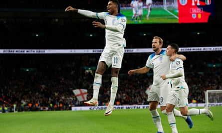 Marcus Rashford celebrates after scoring to make it 2-1