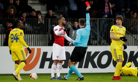 Arsenal’s Alexandre Lacazette is shown a red card by referee Srdjan Jovanovic for an elbow on Aleksandar Filipovic of Bate Borisov