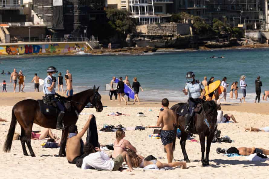 Mounted police patrol Bondi beach as part of Sydney lockdown.