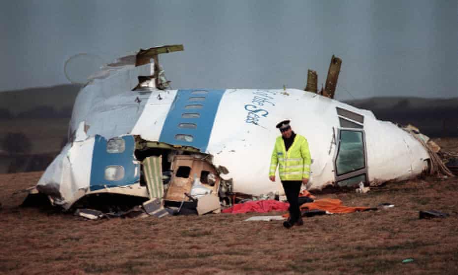 A photo taken on 22 December 1988, shows a policeman walking away from the damaged cockpit of the 747 Pan Am airliner that exploded and crashed over Lockerbie, Scotland, with 259 passengers on board. 