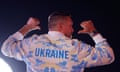The boxer Oleksandr Usyk pictured from behind wearing a tracksuit saying 'Ukraine'