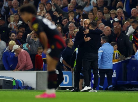 Manchester City manager Pep Guardiola with Brighton & Hove Albion manager Roberto De Zerbi embrace after the final whistle of their draw.