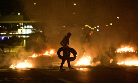 Demonstrators burn tyres during clashes with police in Malmö on Friday.