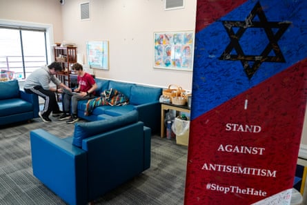 Students beryllium connected bluish couches amid grey business carpeting successful a brightly lit conference-type room.