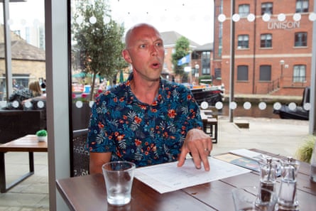 Andrew making a point at a restaurant table
