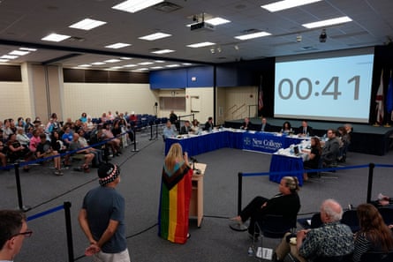 a woman speaking in front of panel