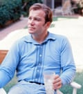 William Shatner relaxing in a deckchair with a drink