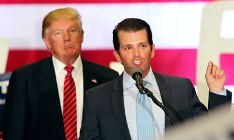 Donald Trump listens to his son Donald Trump Jr during his presidency campaign.