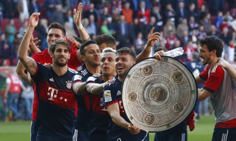 Bayern Munich players celebrate the title – with a replica of the Bundesliga trophy.
