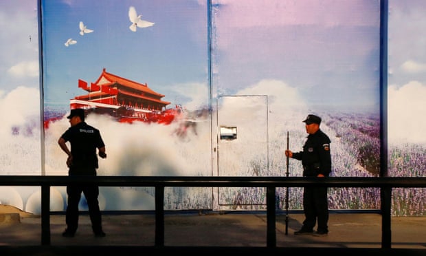 Security guards at the gates of what is officially known as a vocational skills education centre in Huocheng county