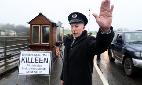 Demonstrators dressed as custom officials set up a mock customs checkpoint at the border crossing in Killeen, near Dundalk to protest against the potential introduction of border checks post-Brexit.