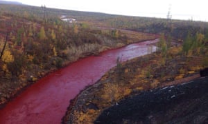 The red Daldykan river in Norilsk, Russia