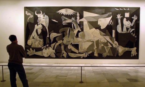 A person views Spanish artist Pablo Picasso’s world famous painting Guernica at Madrid’s Reina Sofia museum, Spain, April 2000.
