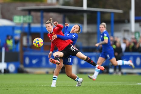 Hayley Ladd of Manchester United is challenged by Lauren James as the second half gets underway.
