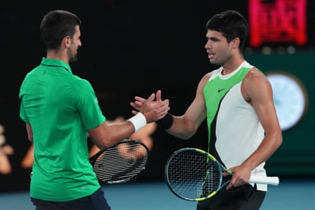 Novak Djokovic shakes hands with a victorious Carlos Alcaraz after the Spaniard beat him in the Australian Open final in February