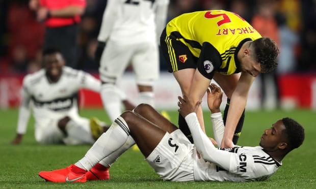Craig Cathcart of Watford consoles Ryan Sessegnon after Fulham’s relegation was confirmed. 