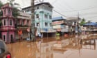 Indian couple float to their wedding in a cooking pot along flooded streets