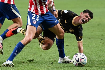 Phil Foden falls over in pain.