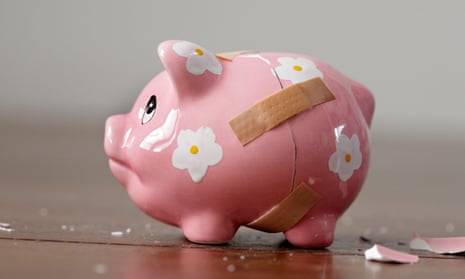 Close-up of a broken piggy bank with bandages on it
