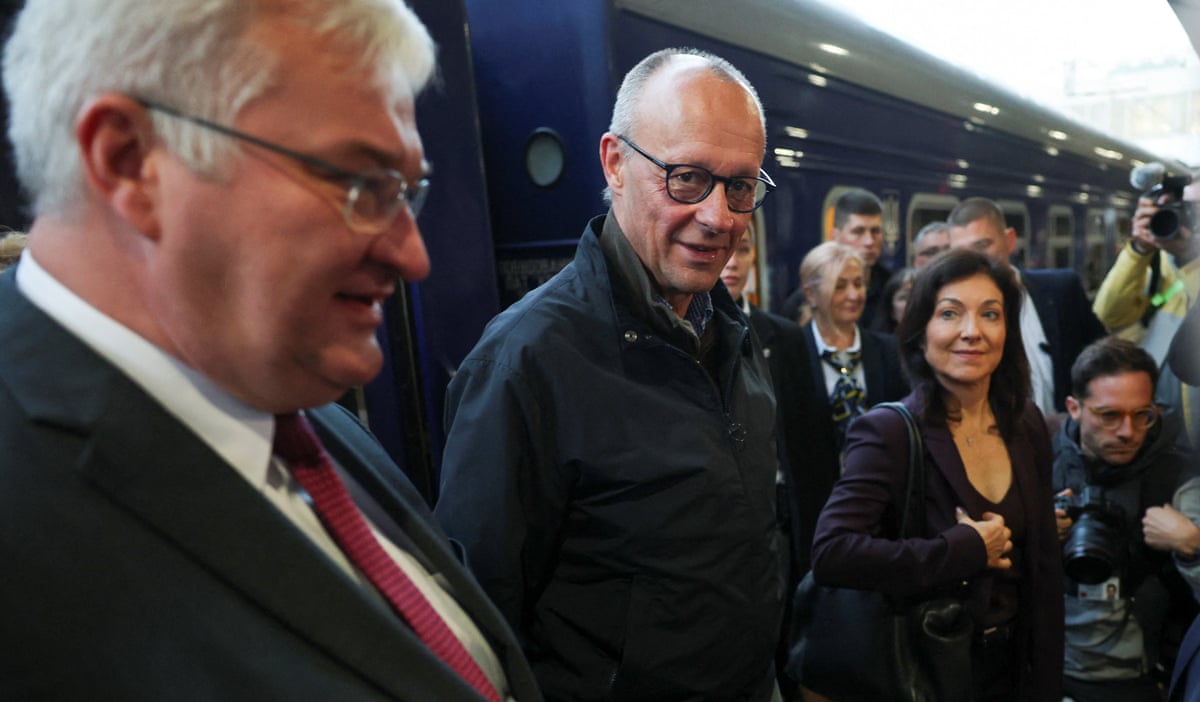 German Chancellor Friedrich Merz and Economy and Energy Minister Katherina Reiche meet Ukrainian Foreign Minister Andrii Sybiha at a railway station, amid Russia’s attack on Ukraine, in Kyiv, Ukraine, October 4, 2026.