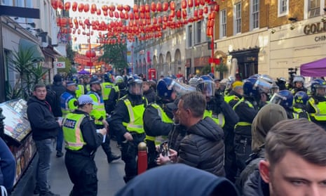 Police officers scuffle with protesters in London’s Chinatown