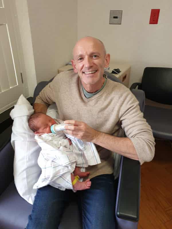 Simon Burrell feeding his son, William, in hospital