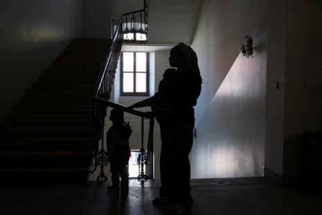 Mother with children in stairwell in silhouette