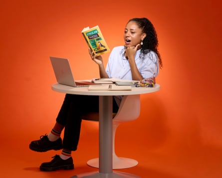 Micha Frazer-Carroll reads a book about Jamaican Patois.