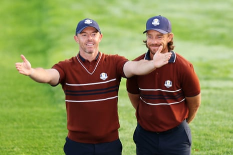 Rory McIlroy of Team Europe and Tommy Fleetwood of Team Europe acknowledges the crowd